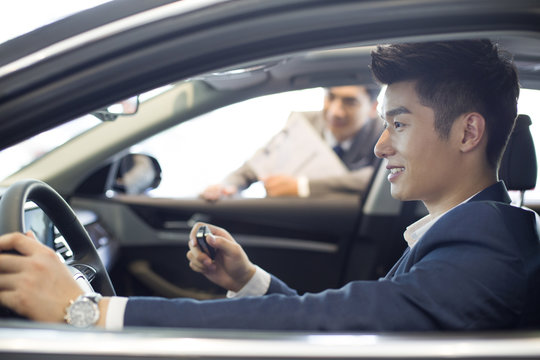 Young businessman taking a test drive