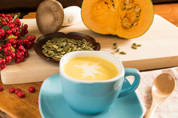 Pumpkin soup in a blue bowl