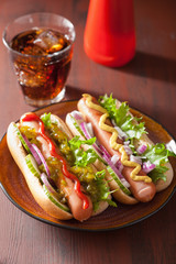 grilled hot dogs with vegetables ketchup mustard