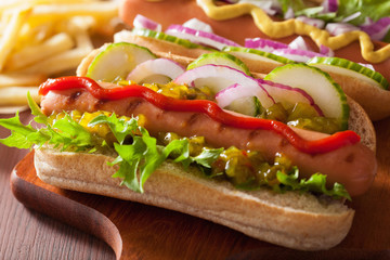 grilled hot dogs with vegetables ketchup mustard