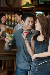 Couple Enjoying Cocktails Together