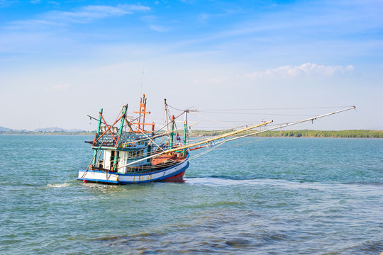 Small fishing boats near the island of Chanthaburi , Thailand