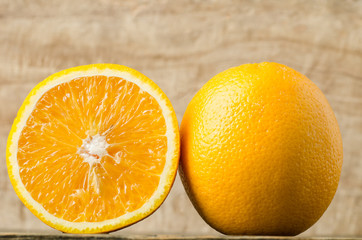 Fototapeta premium Fresh navel orange fruit on wooden background,healthy food