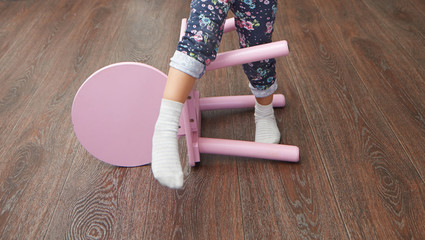 Child overstepping chair