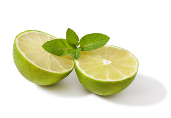 Fresh slice of lime with mint isolated on a white background 