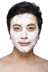 Handsome young man with facial mask