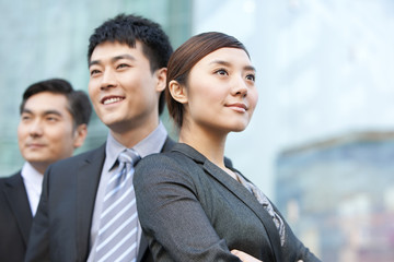 Chinese business people looking into the distance