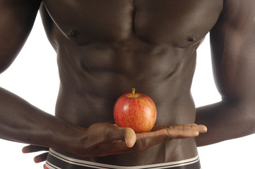 African man with an apple on white