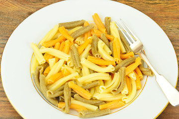 Pasta. Colorful Noodles on Plate.
