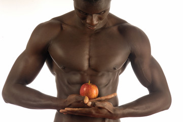 African man with an apple on white