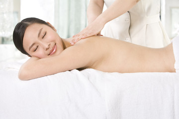Fototapeta na wymiar Young woman getting a massage