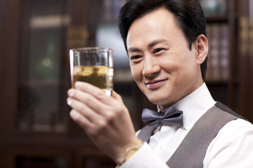 Businessman appreciating fine wine