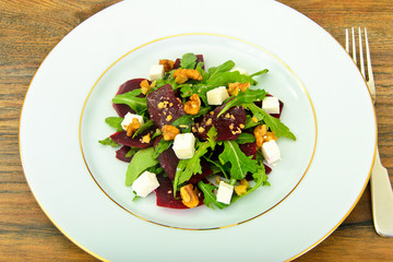 Salad of Raw Beets, Pears, Arugula, Roots, Sunflower Seeds and C