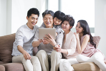 Happy family with digital tablet