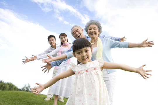 The whole family playing in the park