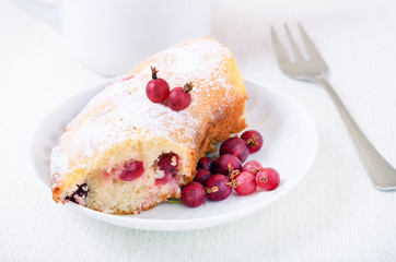 Piece of gooseberries pie and powdered sugar