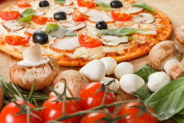 Fototapeta na wymiar Pizza with mushrooms and vegetables