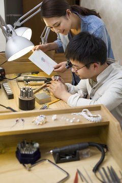 Jewelers making a sapphire ring