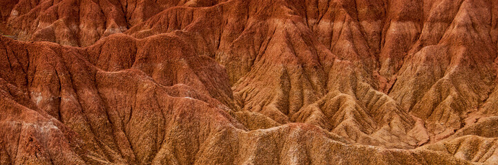 Detail of Drought red orange sand stone rock formation in Tatacoa desert, Huila