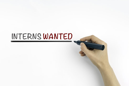 Hand with marker writing: Interns Wanted