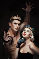 Man and a woman with crown on his head.