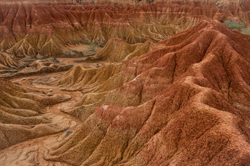 Drought red orange sand stone rock formation in Tatacoa desert, Huila