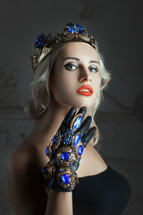 Close-up portrait of a woman with jewelry.