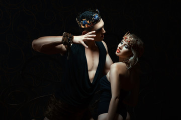 Man holds girl passionately.