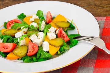 Healthy and Diet Food: Salad, Persimmon, Pickled Cucumber, Tomat