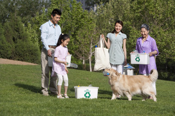 Family recycling in the park