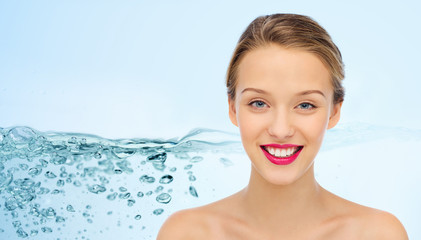 smiling young woman face and shoulders