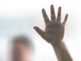 Human finger on glass background