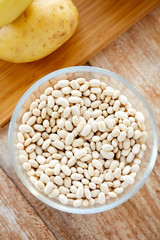 close up of beans in glass bowl on table