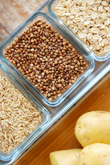 close up of grain in glass bowls on wooden table