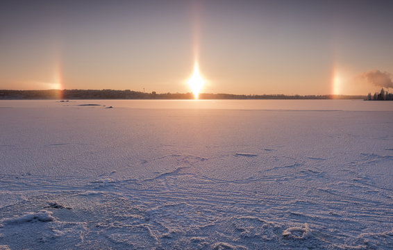 Sun dogs with lake view at the time of blue moment