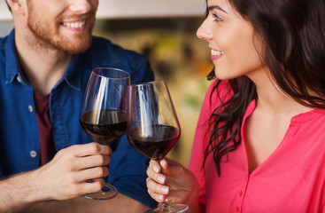 happy couple dining and drink wine at restaurant