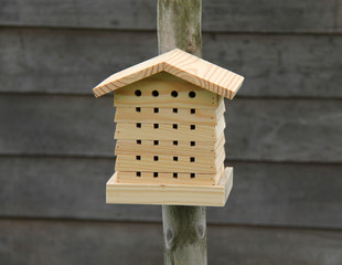 A New Wooden Insect House Fitted to a Post.