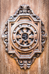 Detail of an ancient wooden door carved.