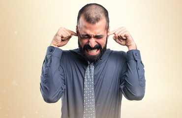 Obraz premium Man covering his ears