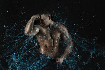 Male figure in bursts and drops of water.