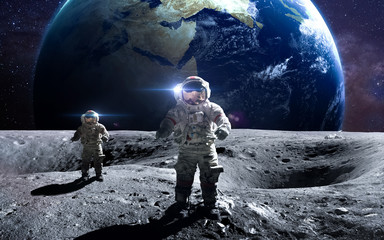 Brave astronaut at the spacewalk on the moon. This image elements furnished by NASA.