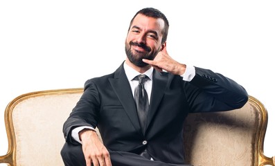Businessman making phone gesture