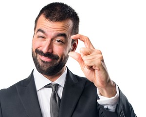 Businessman doing tiny sign