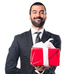 Businessman holding a gift