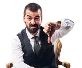 Businessman doing bad signal