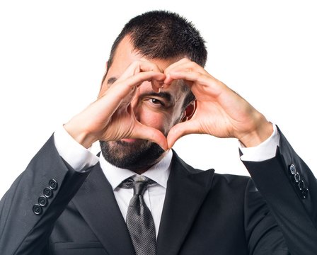 Businessman making a heart with his hands