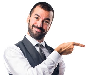 Businessman pointing to the lateral