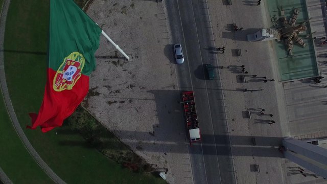 Portuguese Waving Flag on top of the Eduardo VII Park in Lisbon, Portugal