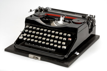 Old typewriter machine isolated on white