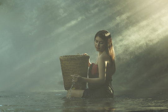 The girl bathed in a the creek.